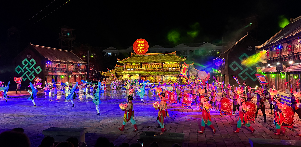 Vibrant performers in traditional attire take the stage in the 